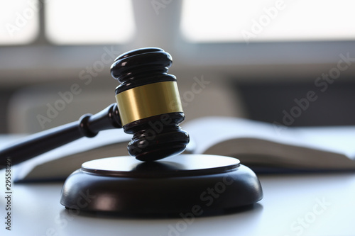 Fotomural The judge hammer lies on table in debate room for fair judgments economic notion