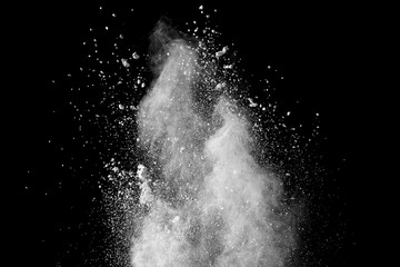 Wall Mural - Bizarre forms of white powder explosion cloud against black background.White dust particles splash.