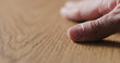 © GCapture - man hand touch oil finished oak wood surface