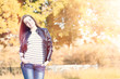 © alexkich - Young girl on a walk. Girl in a leather jacket on the street. Beautiful girl in the park.