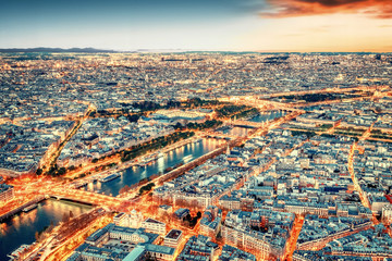 Wall Mural - Paris city skyline rooftop view with River Seine at night, France. Evening panorama.