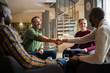 © JonoErasmus - Hand Shake. Diverse South African business meeting in modern office space