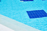 Fototapeta Przestrzenne - Background of water in blue swimming pool, water surface with a sun reflection