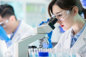 Poster - Asian scientist use microscope