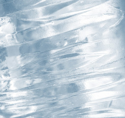 Wall Mural - ice background. pattern of transparent shiny ice. natural bright background