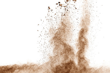 Wall Mural - Brown dust explosion cloud.Brown particles splatter on white background.