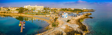 Panorama Of Cyprus From A Height. Mediterranean Sea. Protaras. The Port Of Paralimni. Pernera. Top View Of Kalamies Beach. Church Of St. Nicholas In Cyprus. Beach Resort. The Temple Of Agios Nikolaos