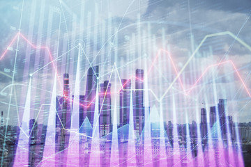 Double exposure of financial graph on downtown veiw background. Concept of stock market research and analysis