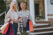 © Yakobchuk Olena - Two smiling fashionable ladies with their purchases