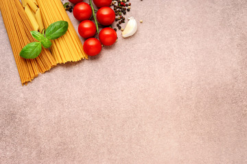 Wall Mural - Pasta ingredients on light rustic background with copy space