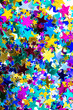 © squeebcreative - Glitter Tinsel Stars Close Up For Background