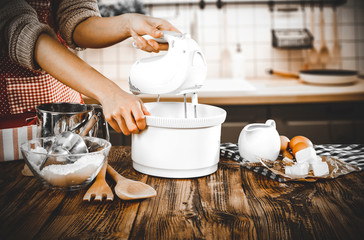 Poster - Woman hands in kitchen and free space for your decoration. 