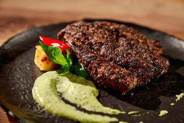 Wall Mural - Tasty steak with spinach sauce.