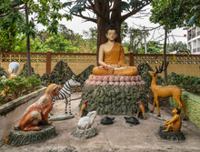 Bang Saen, Thailand - March 16, 2019: Wang Saensuk Buddhist Monastery. Group Of Colorful Sculptures Depicting Buddha Giving His First Sermon On Noble Truths To Five Disciples.