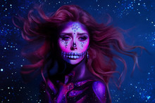 Portrait Charming Young Woman With Cute Pink Face Red Hair Flying From Wind Poses In The Purple Neon Light, Image Of Skeleton Using Body Art, Dead Princess. Celebrate Dia De Los Muertos. Parade Legend