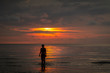 © SearchingForSatori - standing in the asian sea at sunset