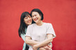 © Alessandro Biascioli - Happy Asian mother and daughter having fun outdoor - Chinese family people spending time together outside - Love, relationship and parenthood lifestyle concept