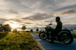 biker on the road on sunset