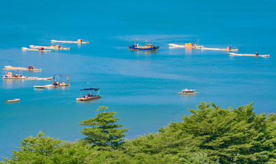 Fishing boats on the blue coast of The North Sea City of Guangxi