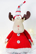 Moose toy dressed as Santa, Christmas moose with a hat, cute Christmas toy