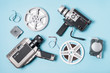 © Freepik - An overhead view of film strips; film reel and various type of camcorder on blue background