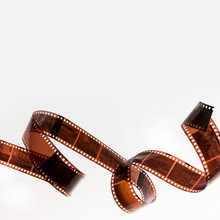 Curled Filmstrip Isolated On White Background