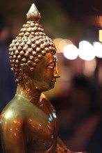 Closeup Of A Golden Buddha Statue In A Thai Temple