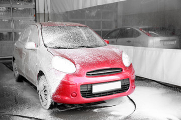 Canvas Print - Auto covered with foam at car wash. Cleaning service