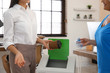 © New Africa - Women with garbage at recycling bin in office, closeup