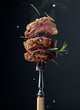 Grilled ribeye beef steak with rosemary on a black background.