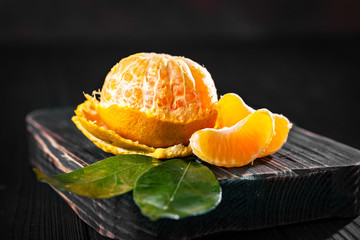 Wall Mural - Tangerines on an old fashioned country table. Selective focus. Horizontal.