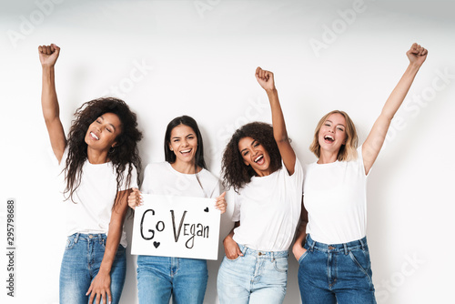 Fotografía Friends posing isolated holding blank with motivation vegan text.