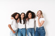 © Drobot Dean - Cheery young women multiracial friends posing isolated