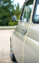 Wall Mural - Vintage beige color car. Small old car. Italian car.