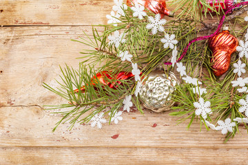 Vintage Christmas tree toys. New Year holiday concept. Evergreen pine branch, old wooden boards background