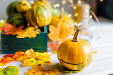 Wall Mural - autumn background with pumpkins and leaves and candle