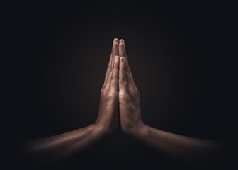 praying hands with faith in religion and belief in god on dark background. power of hope or love and
