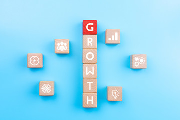 Wall Mural - Action plan and Business process management concept, wooden blocks with word GROWTH and business strategy icons on blue background, copy space