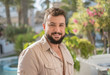 © FotoAndalucia - Forty years old man portrait in garden looking at camera and smirking