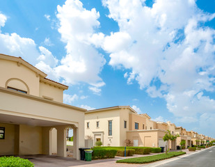 Wall Mural - Luxury villa compound housing development with beautiful blue sky with white clouds