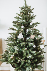 christmas / new year composition. festive fir-tree decorated with toys, gifts, balls. winter holiday