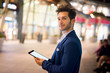 © Minerva Studio - Portrait of man using his tablet in a city at night