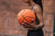 © Drobot Dean - Attractive young african sportswoman playing basketball