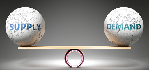 supply and demand in balance - pictured as balanced balls on scale that symbolize harmony and equity