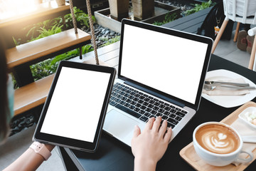 Wall Mural - Close up of man using laptop,sending massages on the garden.having sunbath.Phone with black screen,texting,video calls,