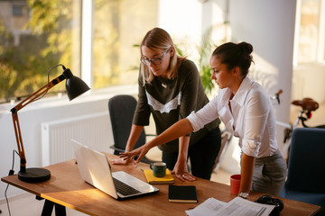 Businesswomen discussing work in the office 