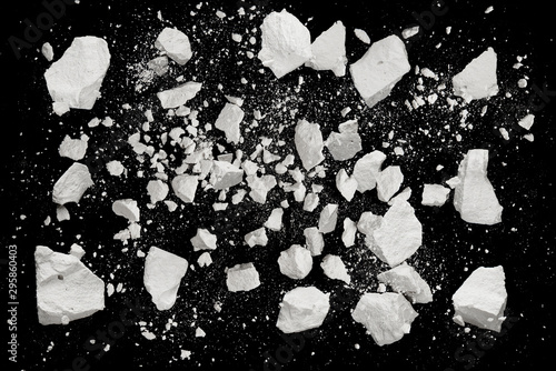 Fotomural Rock stone broken explosion split piece isolated on black background photo objec