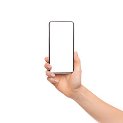 Fototapete - Woman's hand holding cellphone with big blank screen