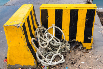 Yellow and black road separator.