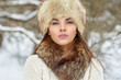 © paultarasenko - Beautiful winter woman portrait in fur hat - close up